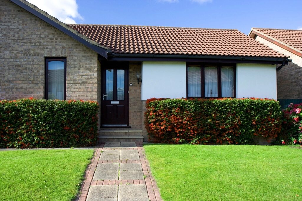 Front lawn and walkway of a brick home